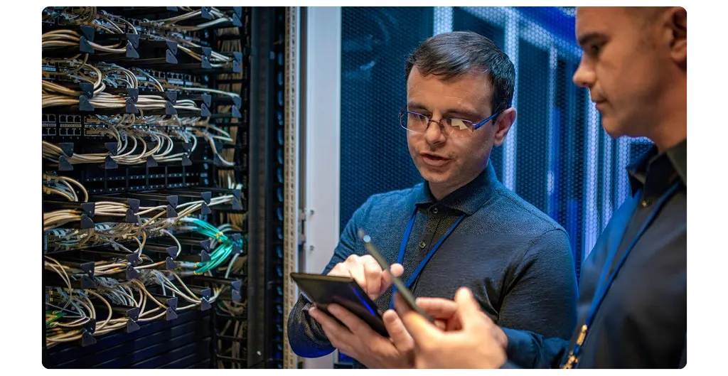 IT technicians managing client servers in a data centre at 151 Front Street West